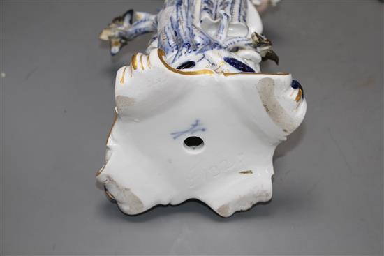 A pair of Meissen porcelain candelabra, modelled with lady and gallant stems, height 46cm